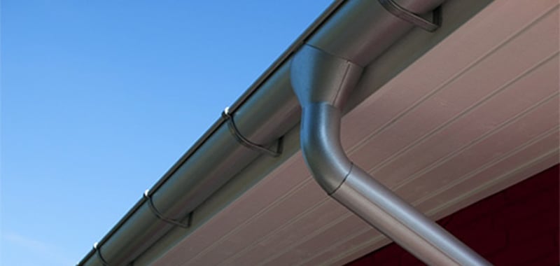 Downpipe connected to eaves gutters