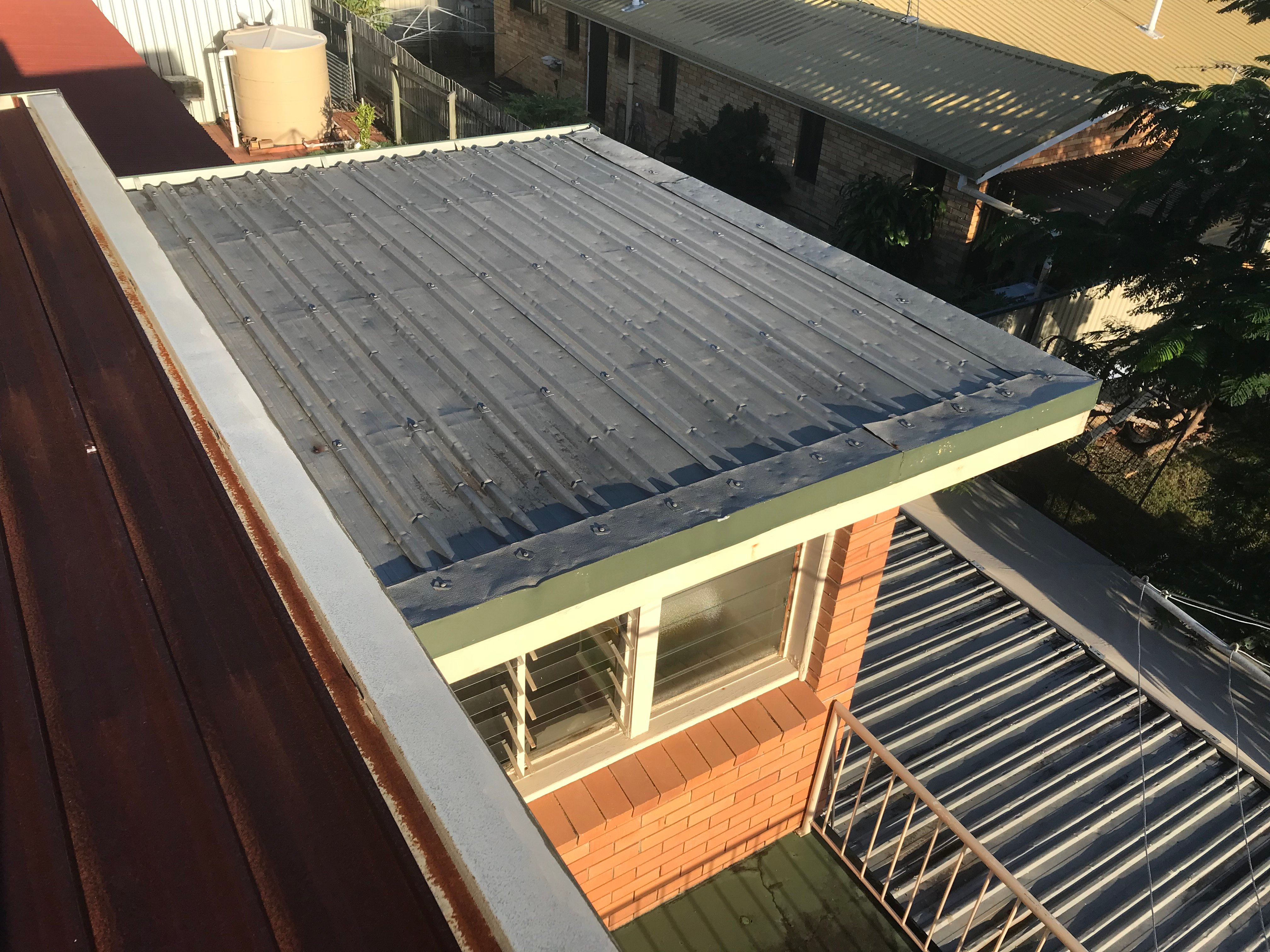 Flat roof with hail damage in brisbane