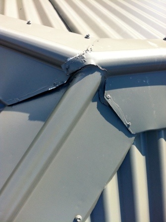 Poorly installed ridge capping, untidy cuts and gaps