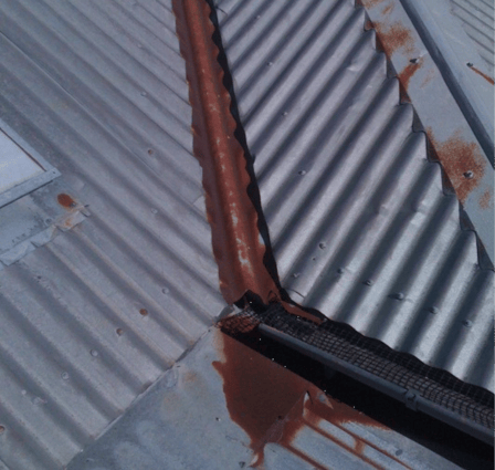 Rusted valley flashing between roof sheets