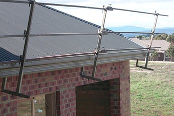 House with on-roof edge rail installed to perimeter