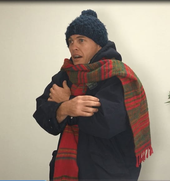 Video still - Our director Luke wearing 'insulation' - jacket, scarf and beanie.